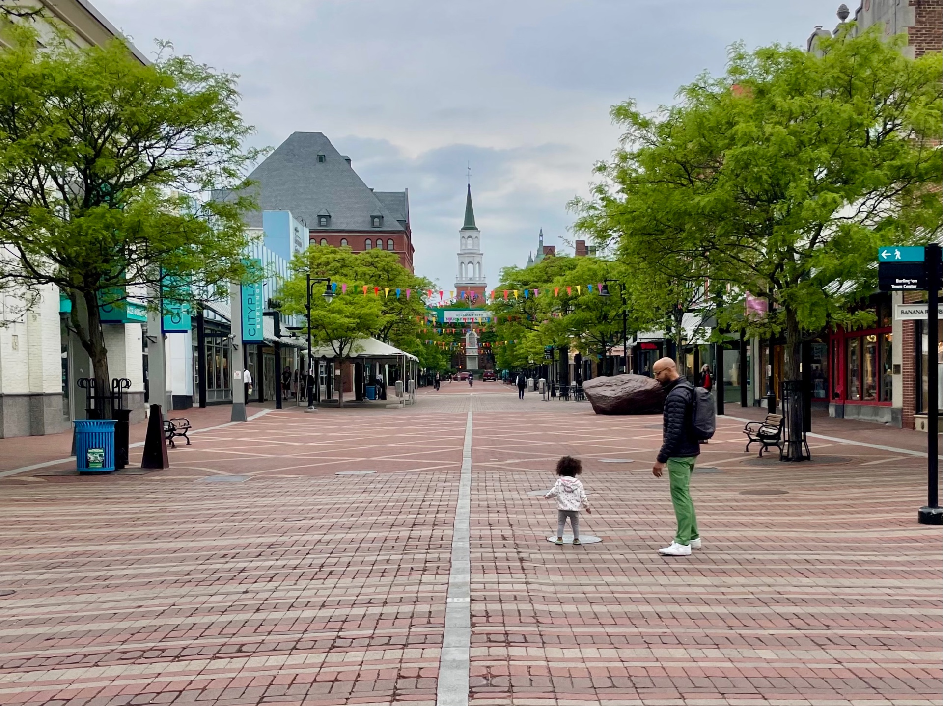 Frank walking behind his daughter Olive on Church Street Marketplace in Burlington, Vermont.